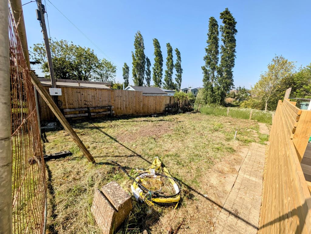 Lot: 92 - LAND WITH PLANNING FOR A DETACHED CHALET STYLE HOME - Looking back into the Site